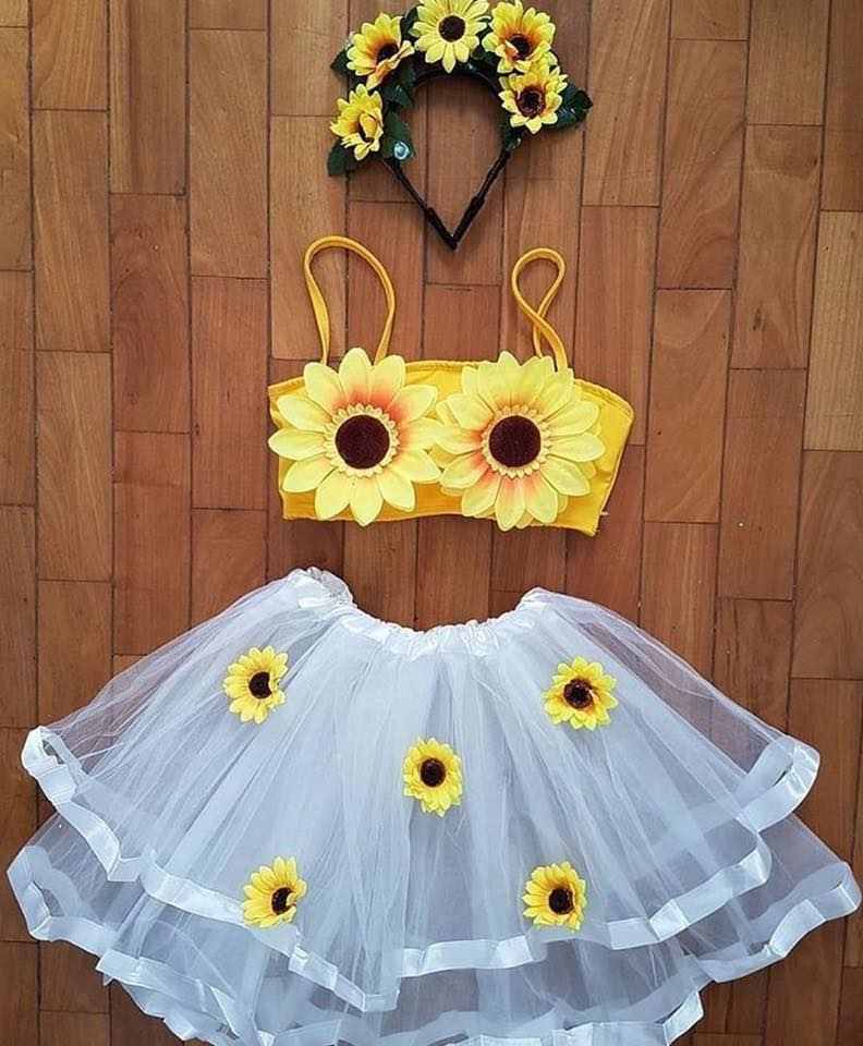 falda de tul blanco y top amarillo