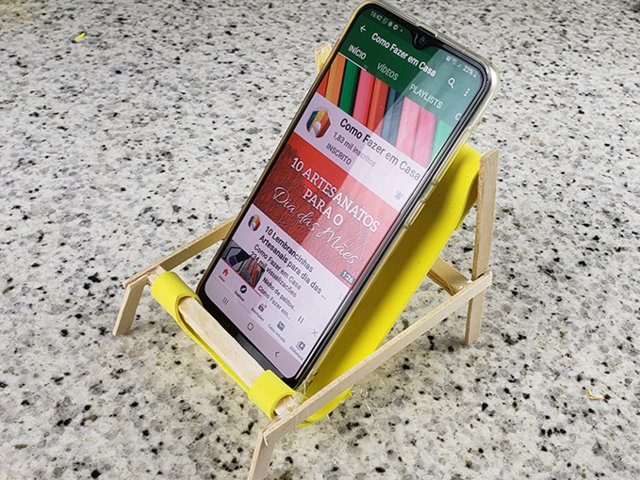 Soporte para teléfono celular con palillos 